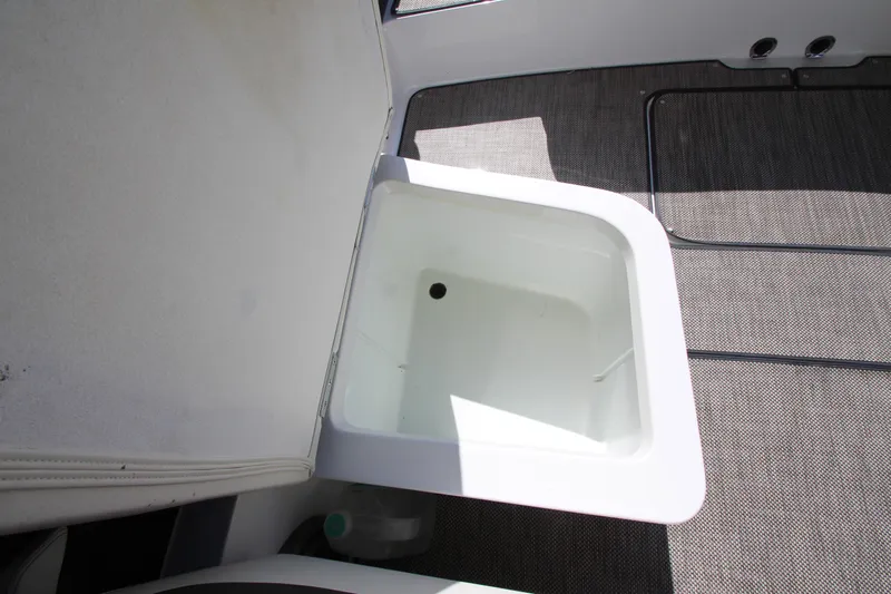  Yacht Photos Pics Open storage compartment on 2016 Cobalt R30 boat, featuring clean interior and carpeted flooring.