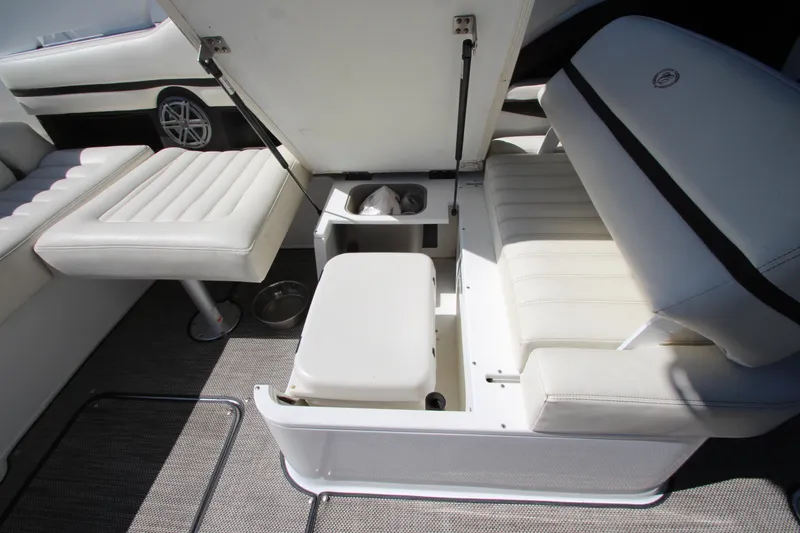  Yacht Photos Pics 2016 Cobalt R30 boat interior with white seating and storage compartments.