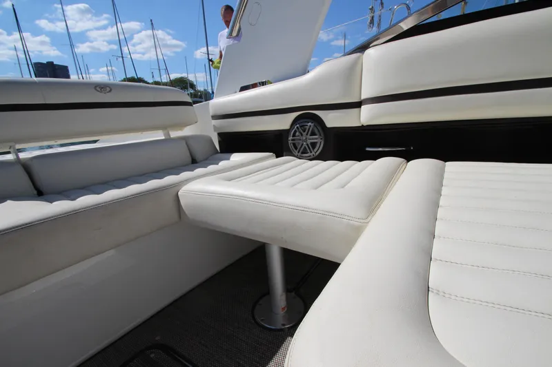  Yacht Photos Pics 2016 Cobalt R30 boat interior with white leather seating and open deck.