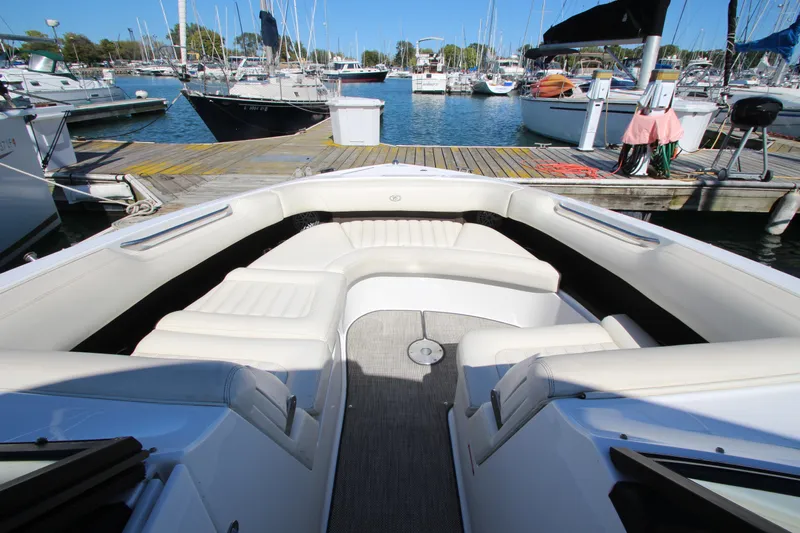  Yacht Photos Pics Bow seating area of a 2016 Cobalt R30 boat docked at a marina.