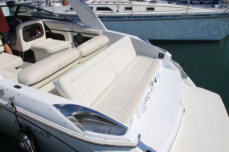  Yacht Photos Pics 2016 Cobalt R30 boat with white seating and sleek design in a marina.