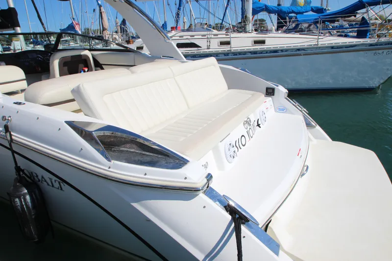  Yacht Photos Pics 2016 Cobalt R30 boat with white seating, docked in a marina.
