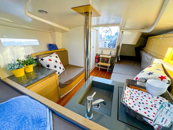 4797ak Yacht Photos Pics Interior of 2021 Saffier 33 SE sailboat with cozy seating and modern kitchen area.