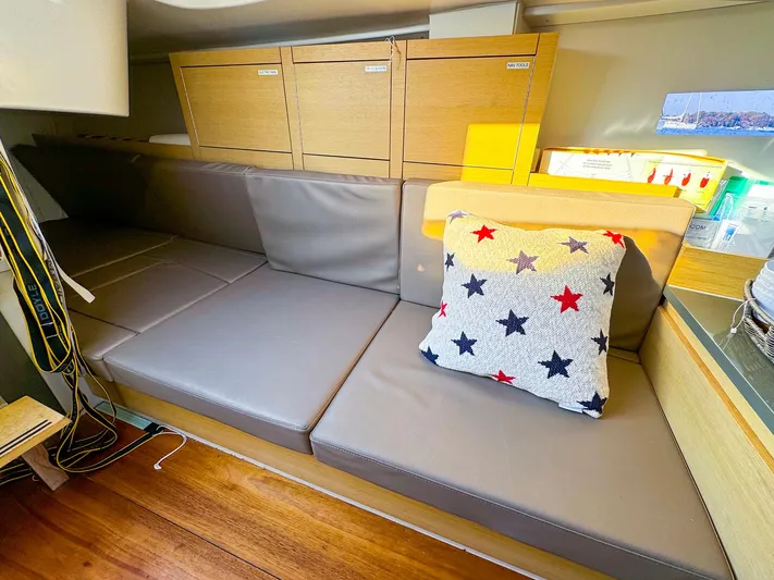 4797ak Yacht Photos Pics Interior of 2021 Saffier 33 SE yacht with cushioned seating and star-patterned pillow.