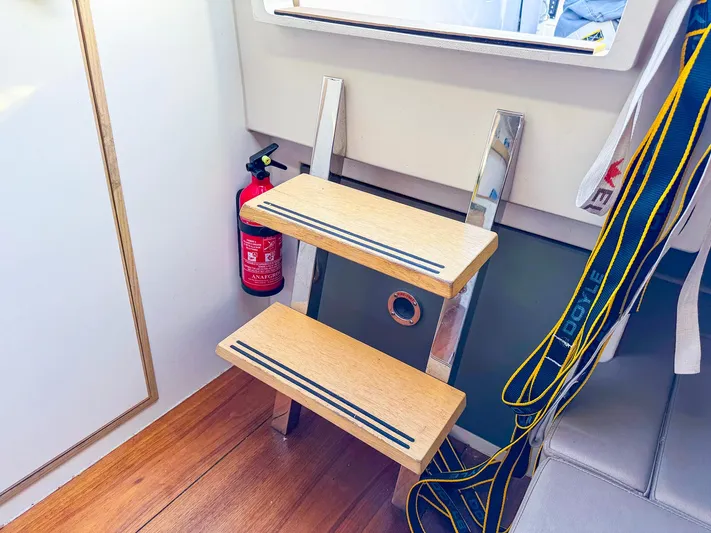 4797ak Yacht Photos Pics Interior of 2021 Saffier 33 SE yacht with wooden steps and fire extinguisher.
