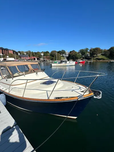 Golden Gate Yacht Photos Pics Hinckley T29 Express 1997 boat docked in a scenic marina under clear blue skies.