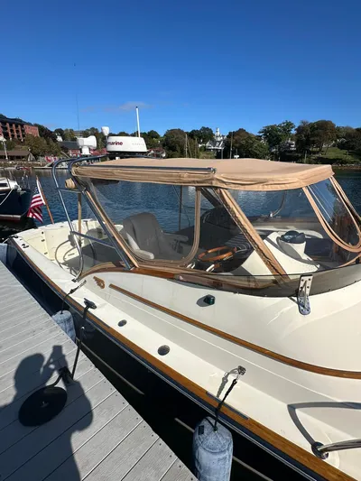 Golden Gate Yacht Photos Pics Hinckley T29 Express 1997 boat docked, featuring beige canopy and sleek design.
