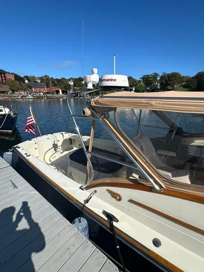 Golden Gate Yacht Photos Pics Hinckley T29 Express 1997 docked by a scenic waterfront with clear blue skies.