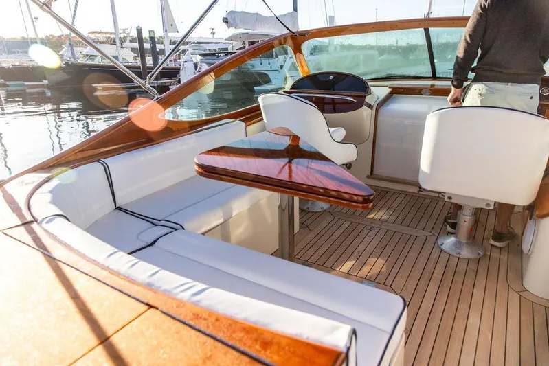 Coot Yacht Photos Pics Luxurious 2005 Hinckley Talaria 29R yacht interior with elegant seating and wooden accents.
