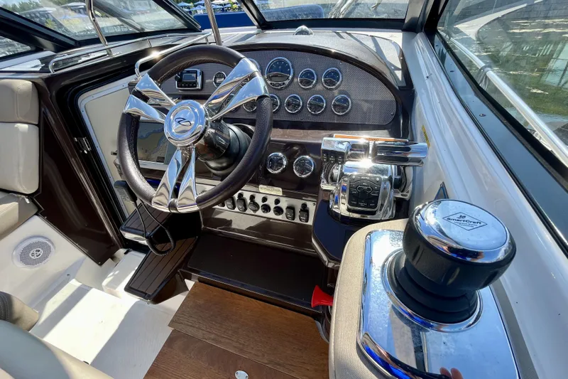  Yacht Photos Pics Cockpit of 2013 Regal 35 Sport Coupe with modern steering and controls.