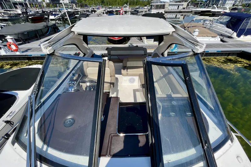  Yacht Photos Pics 2013 Regal 35 Sport Coupe at marina, showcasing open cockpit and sleek design.