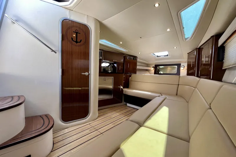  Yacht Photos Pics Luxurious interior of 2013 Regal 35 Sport Coupe with elegant seating and wood finishes.