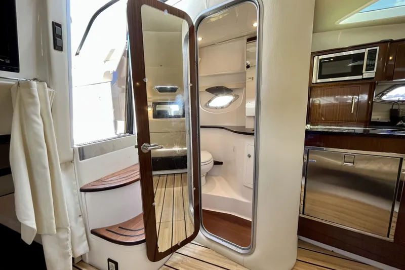  Yacht Photos Pics Interior of 2013 Regal 35 Sport Coupe yacht with modern kitchen and bathroom.