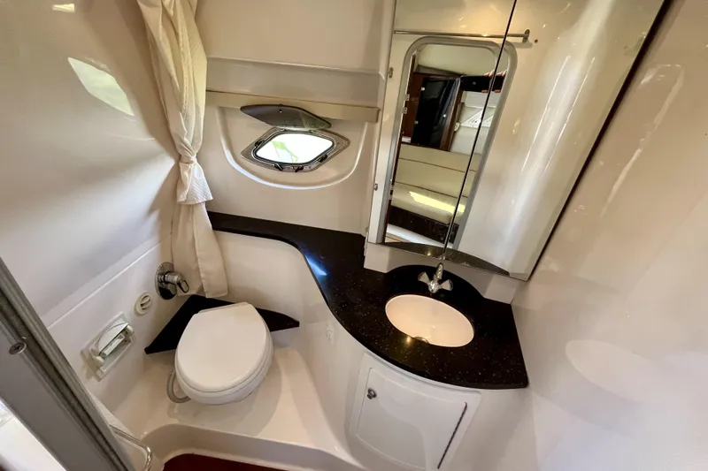  Yacht Photos Pics Bathroom interior of 2013 Regal 35 Sport Coupe with sink, toilet, and mirror.