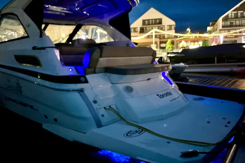  Yacht Photos Pics 2013 Regal 35 Sport Coupe docked at night with blue interior lighting.