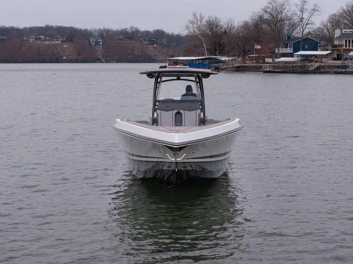  Yacht Photos Pics 2022 Fountain 38 SC boat on a calm lake, front view.