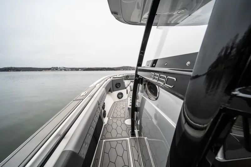  Yacht Photos Pics 2022 Fountain 38 SC boat on calm water, showcasing sleek design and modern features.