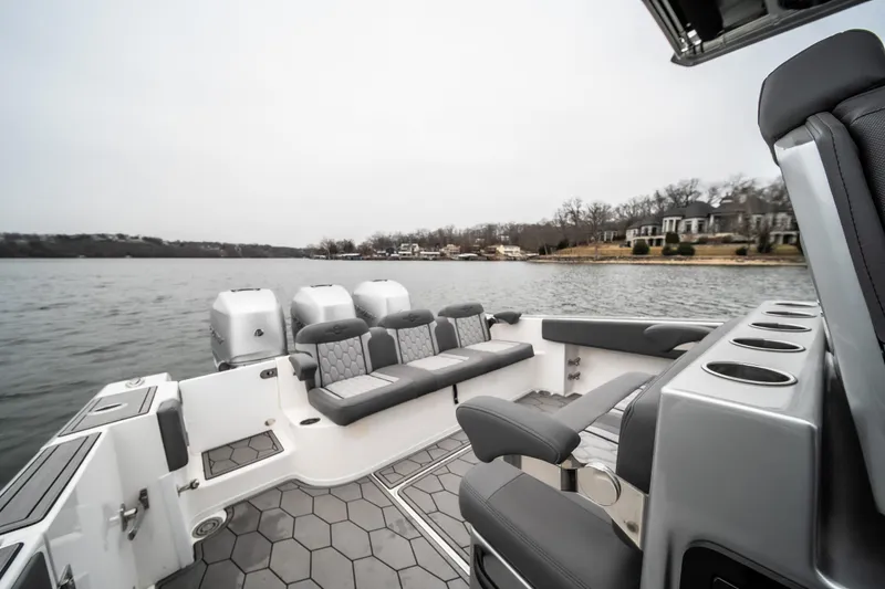  Yacht Photos Pics 2022 Fountain 38 SC boat interior with seating and lake view.