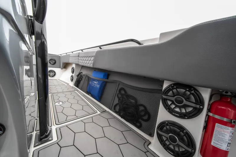  Yacht Photos Pics 2022 Fountain 38 SC boat interior with speakers, fire extinguisher, and storage compartments.