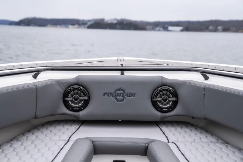  Yacht Photos Pics 2022 Fountain 38 SC boat interior with speakers, on a calm lake.