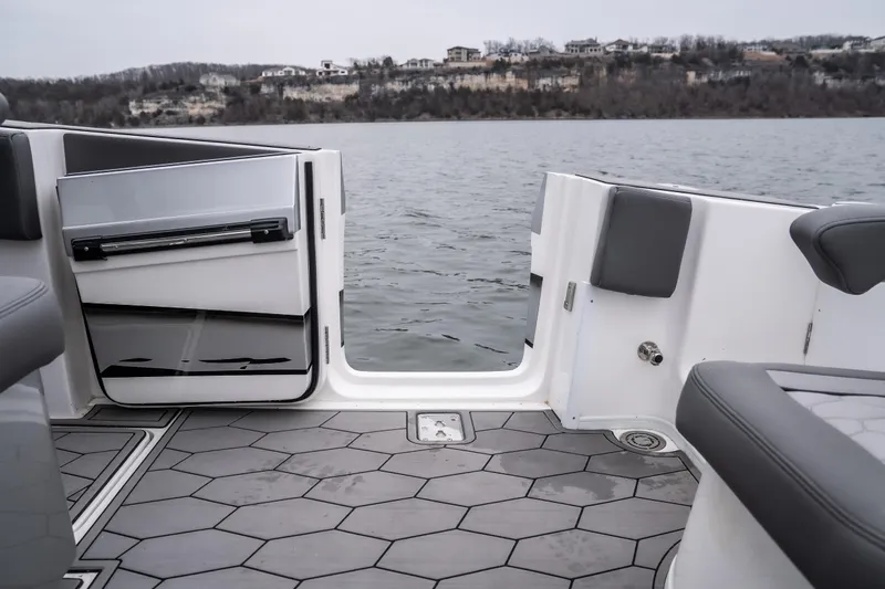  Yacht Photos Pics 2022 Fountain 38 SC boat interior with open door, hexagonal flooring, and lake view.