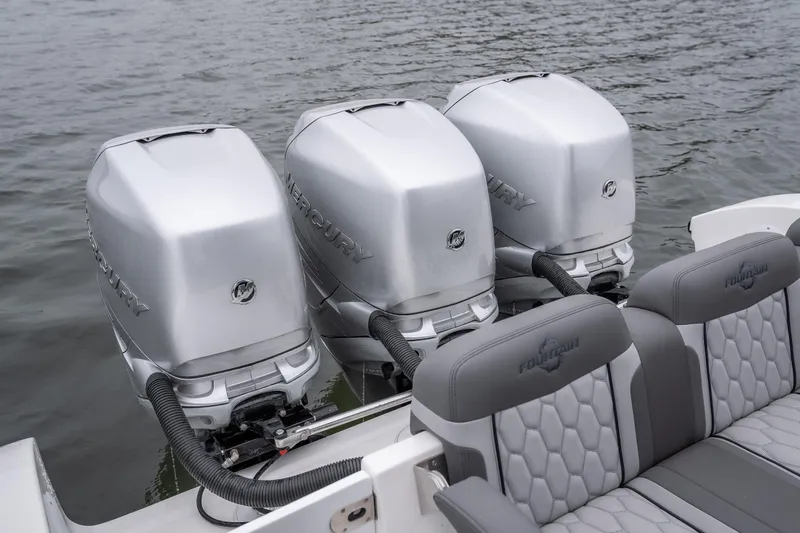  Yacht Photos Pics Triple Mercury outboard engines on 2022 Fountain 38 SC boat, with gray seating.