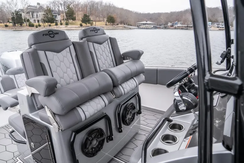  Yacht Photos Pics 2022 Fountain 38 SC boat interior with luxury seating and modern controls on a lake.