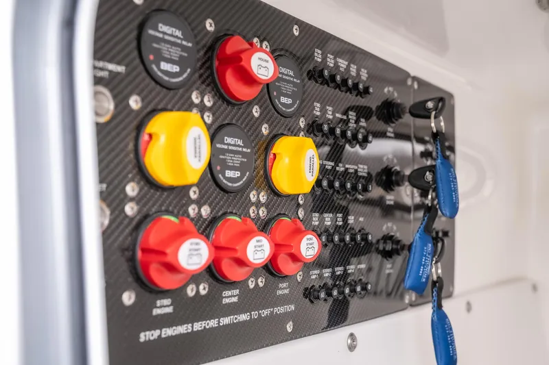  Yacht Photos Pics Control panel of 2022 Fountain 38 SC boat with switches and keys.