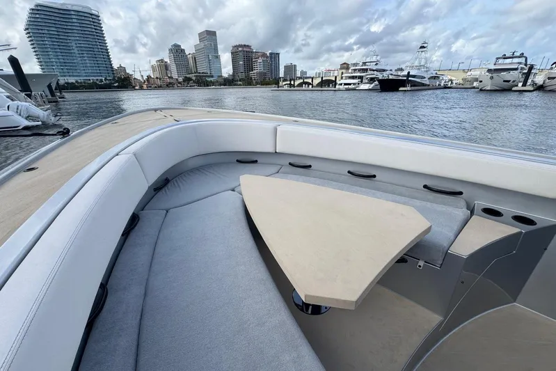 T/t Tenacious Yacht Photos Pics Luxurious 2025 Wajer 38s yacht interior with city skyline and marina view.
