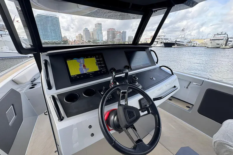 T/t Tenacious Yacht Photos Pics Helm of 2025 Wajer 38s yacht with navigation screens, docked in marina.