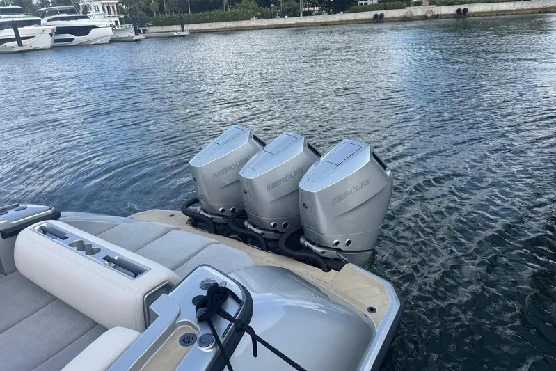 T/t Tenacious Yacht Photos Pics 2025 Wajer 38s boat with triple Mercury outboard engines on a calm waterway.