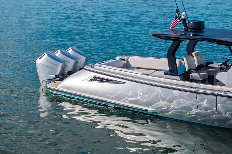 T/t Tenacious Yacht Photos Pics 2025 Wajer 38s luxury boat with triple Mercury engines on calm water.