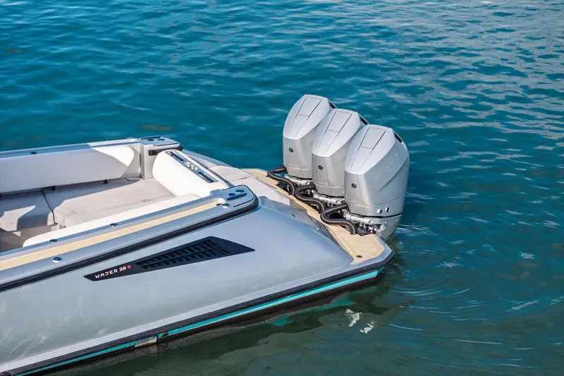 T/t Tenacious Yacht Photos Pics 2025 Wajer 38s luxury boat with triple outboard engines on water.