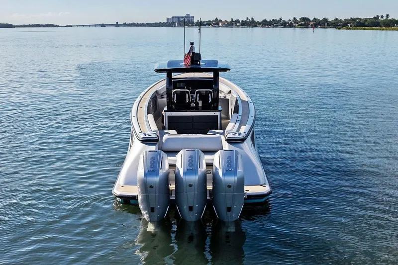 T/t Tenacious Yacht Photos Pics 2025 Wajer 38s boat with triple outboard engines on calm water.