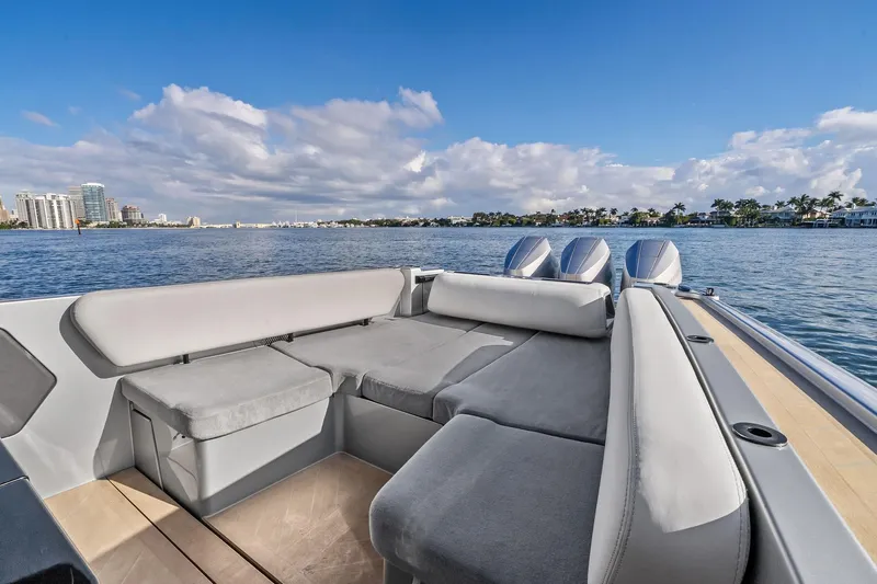 T/t Tenacious Yacht Photos Pics Luxurious 2025 Wajer 38s yacht interior with plush seating, overlooking serene waterfront views.