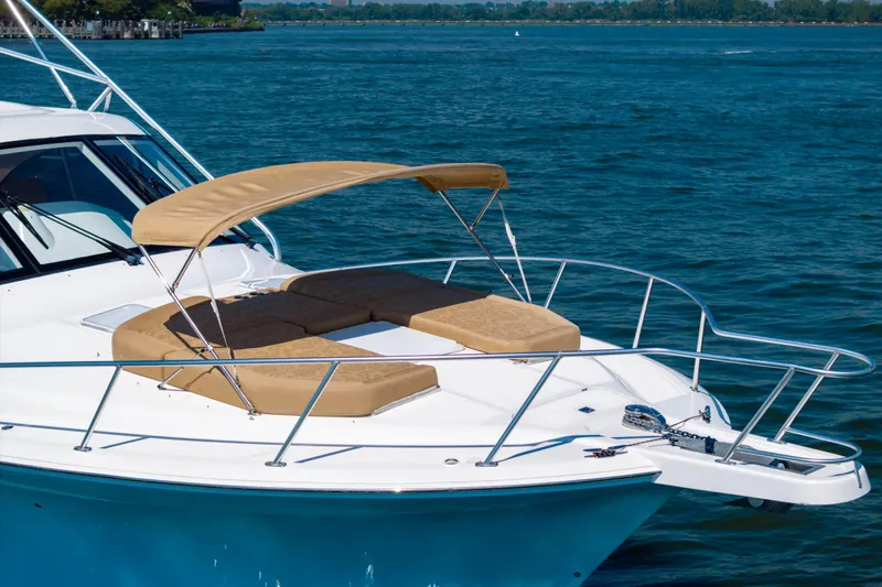  Yacht Photos Pics 2012 Cabo 44 Hardtop Express yacht with sunshade on open water.