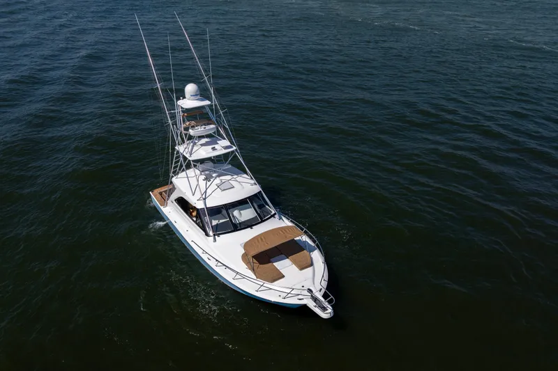  Yacht Photos Pics 2012 Cabo 44 Hardtop Express yacht cruising on open water.