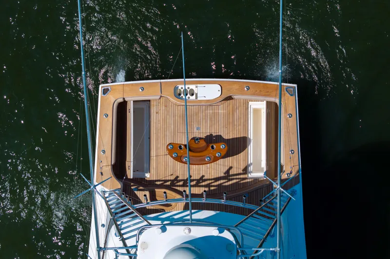  Yacht Photos Pics Overhead view of 2012 Cabo 44 Hardtop Express yacht deck on water.