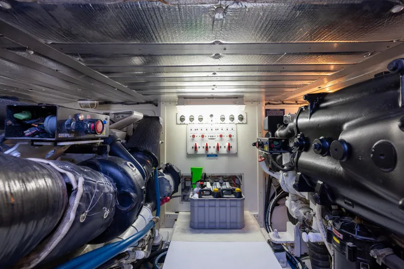  Yacht Photos Pics Engine room of 2012 Cabo 44 Hardtop Express with Caterpillar components and control panel.