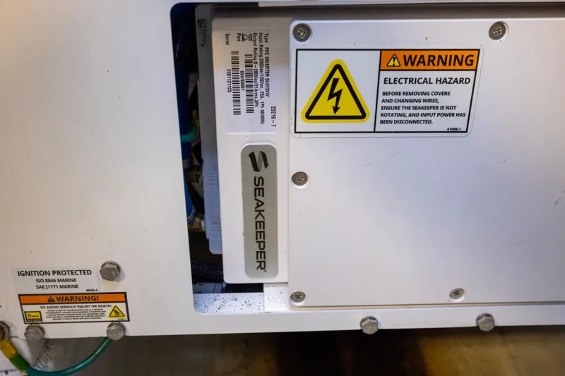  Yacht Photos Pics Seakeeper system with electrical hazard warning on 2012 Cabo 44 Hardtop Express.