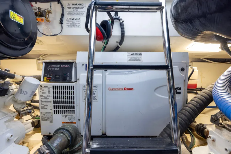  Yacht Photos Pics Engine room of 2012 Cabo 44 Hardtop Express with Cummins Onan generator and ladder.