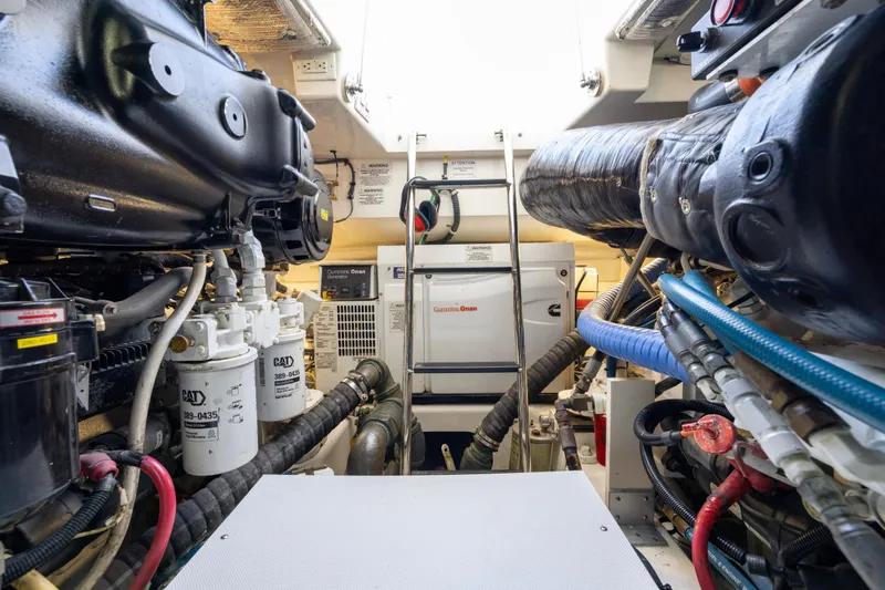  Yacht Photos Pics Engine room of 2012 Cabo 44 Hardtop Express with visible machinery and equipment.