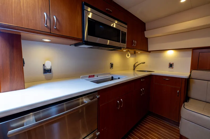  Yacht Photos Pics Luxurious kitchen interior of 2012 Cabo 44 Hardtop Express yacht with modern appliances.