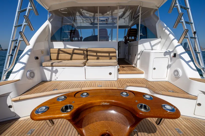  Yacht Photos Pics 2012 Cabo 44 Hardtop Express yacht interior with teak deck and cushioned seating.