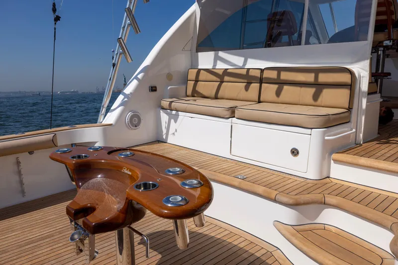  Yacht Photos Pics Luxurious 2012 Cabo 44 Hardtop Express yacht deck with seating and fishing station.