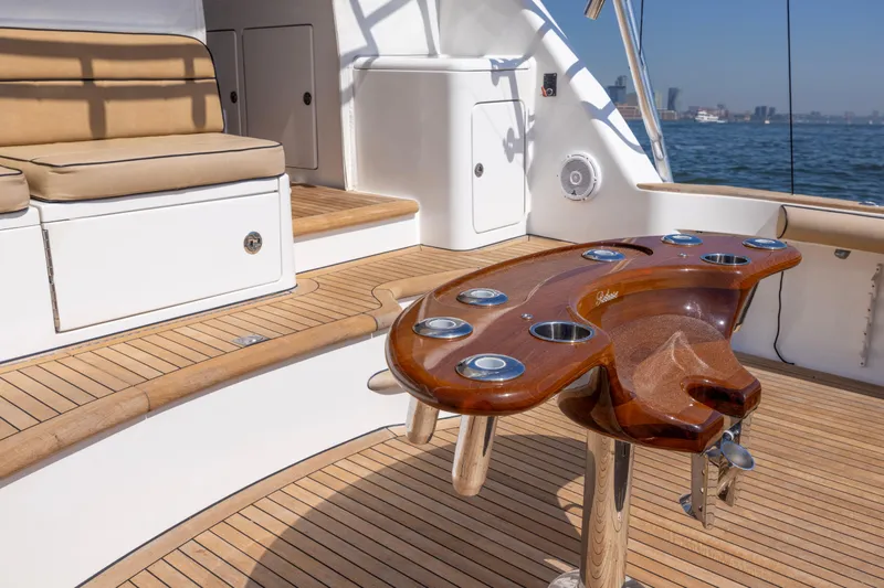  Yacht Photos Pics Luxurious 2012 Cabo 44 Hardtop Express yacht deck with elegant wood finishes.