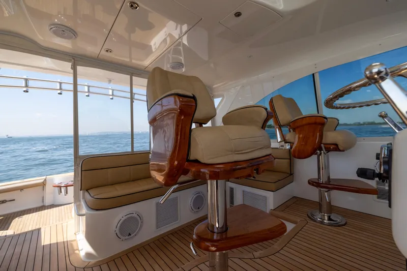  Yacht Photos Pics 2012 Cabo 44 Hardtop Express interior with plush seating and ocean view.