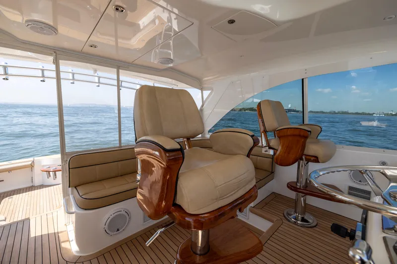  Yacht Photos Pics 2012 Cabo 44 Hardtop Express yacht interior with luxurious seating and ocean view.