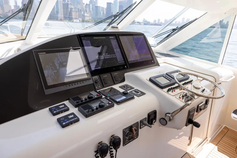  Yacht Photos Pics Helm of 2012 Cabo 44 Hardtop Express yacht with advanced navigation systems.