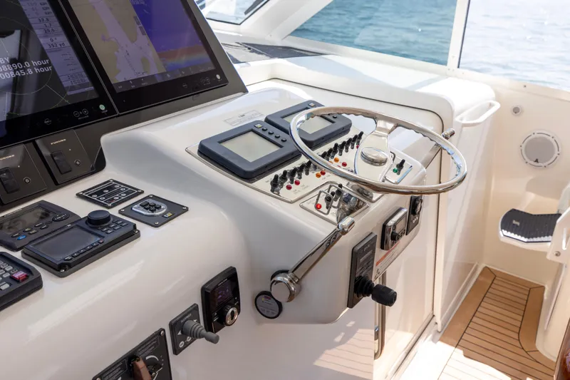  Yacht Photos Pics Control panel of a 2012 Cabo 44 Hardtop Express yacht with navigation equipment.
